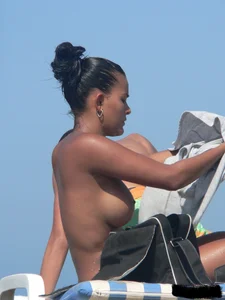 Hot ass topless beach girl with great tits lets her little brother oil up her ass in thong bikini