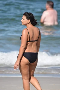 Thick mature brunette bikini lady on the beach with a nice body