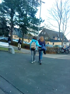 Two teens in jeans in the hood