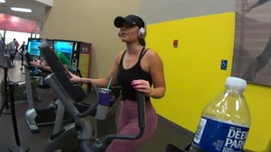 Smoking hot brunette working out at the gym in tight leggings