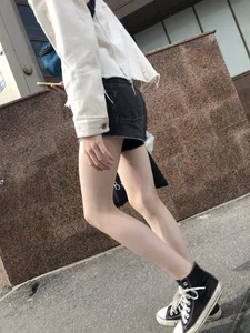 Cute candid teen with pale slim legs in shorts