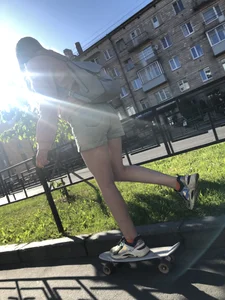Girl in Denim Shorts on Skateboard Street Candid Photos