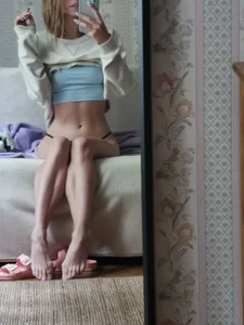 Hot And Fit Barefoot Girl With Flat Abs Mirror Selgie in a Top