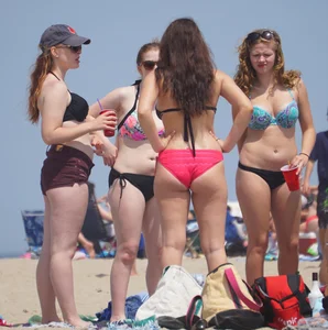 Group of sexy girls on the beach in bikinis with nice bodies