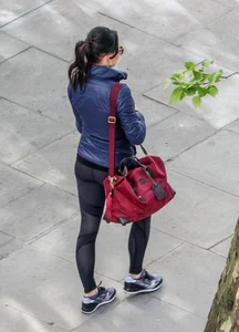 Brunette lady in leggings out walking