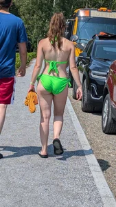 Beautiful Brown hair tight Girl in green bikini on the beach. oc