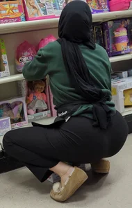 Hijab Princess stocking shelves @ department store