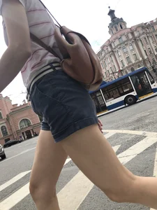 Young Girl in Shorts And Sandals Crossing the Street Gallery