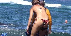 Bikini babe filmed underwater and washing off in sexy little bikini