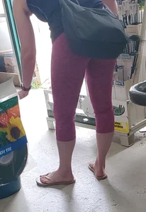 Milf shopping with a nice ass in tight maroon leggings