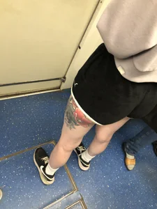 A Tall And Slim Candid Girl in Spandex Shorts in a Hoodie Top, With Tattoos on Her Long Legs Subway Creepshots