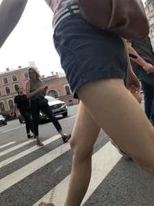 Young Girl in Shorts And Sandals Crossing the Street Gallery