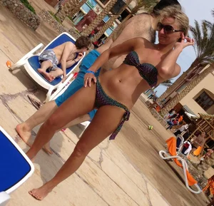 Sexy blonde babe in a bikini at the pool