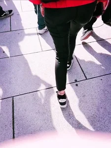 Ass in leather pants closeups on the street