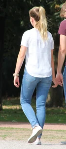 Blonde chick walking with her boyfriend in tight jeans