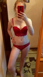 Girl in Sexy Lacey Red Lingerie Making a Selfie in the Mirror