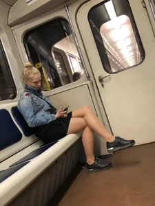 Subway train candid girl sitting with crossed legs