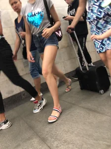 Tall Candid Teen Girl in Denim Shorts And Sandals Sitting in the Subway Train, Then Walking Down the Station