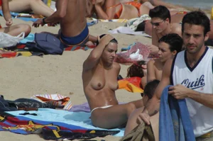 Topless girls on a beach in Barcelona