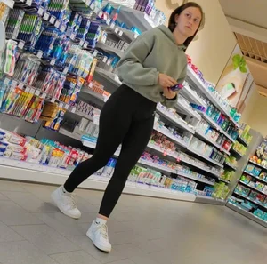 Slim girl with good body in black leggings