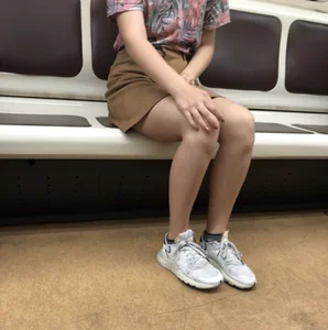 Amazing Hot Girl in a Skirt and Sneakers Sitting Cross-Legged in the Subway Train and on the Escalator Candid Photos Gallery
