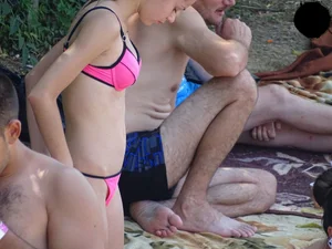 Beautiful and sexy teen in pink thong bikini