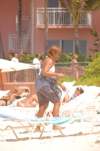 Bunch of sexy girls and milfs in bikinis at the beach
