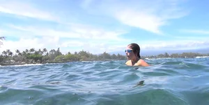 Bikini babe filmed underwater and washing off in sexy little bikini