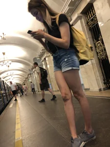 Cute Skinny Teen in Jean Mini Shorts Standing on the Subway Platform