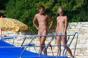 Sexy and skinny blonde nudist milf on the beach