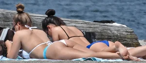 Blondie and two asian girls put on sunscreen (pt 2) [062]
