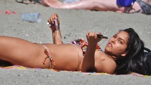 Pretty brunette in a bikini at the beach