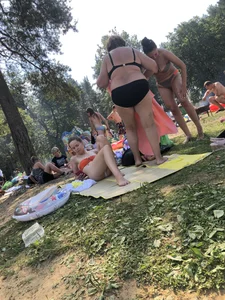 Sexy Girl in Swimsuit Sitting on a Beach With Her Phone Creepshots Gallery