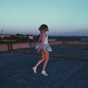 Cute Skinny Teen JB in Short Skirt Jumping