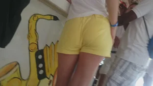 Milf in yellow shorts with vpl and a wedgie