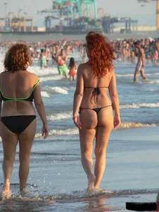 Bunch of sexy babes at the beach in thong bikinis