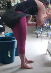 Milf shopping with a nice ass in tight maroon leggings