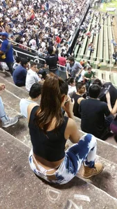Sexy Girl in Tight Jeans With White Whale Tail Panties Sitting at the Stadium Spy Photo
