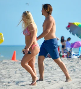 Chubby white girls in bikinis on the beach