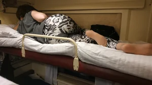 Beautiful Photos of a Girl in Leggings And Pantyhose Lying on Top Shelf of the Train Sleeping Car
