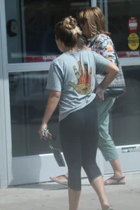 Girl going to TJ Maxx walking in the parking lot in leggings