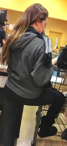Fit shopping brunette girl in leggings and a hoodie with a nice ass