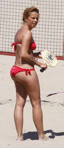 Redhead with nice ass and back dimples in red bikini on the beach