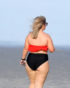 Thick BBW blonde lady in a bikini at the beach