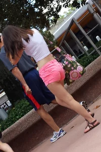 Sexy girl in pink shorts showing some cheek