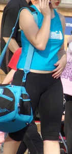 A Hot Candid Girl in Short Tights Touching Her Belly on the Street Creepshot