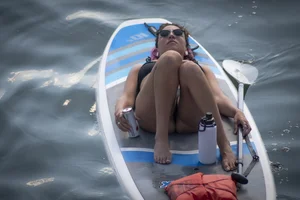 Brunette in thong bikini shows ass, crotch, boobs, and feet