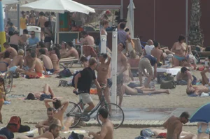 Topless girls on a beach in Barcelona