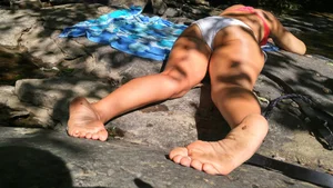 Sexy bikini ass laying out on the rocks up close