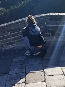 Squatting Candid Girl in Jeans Flashing Booty